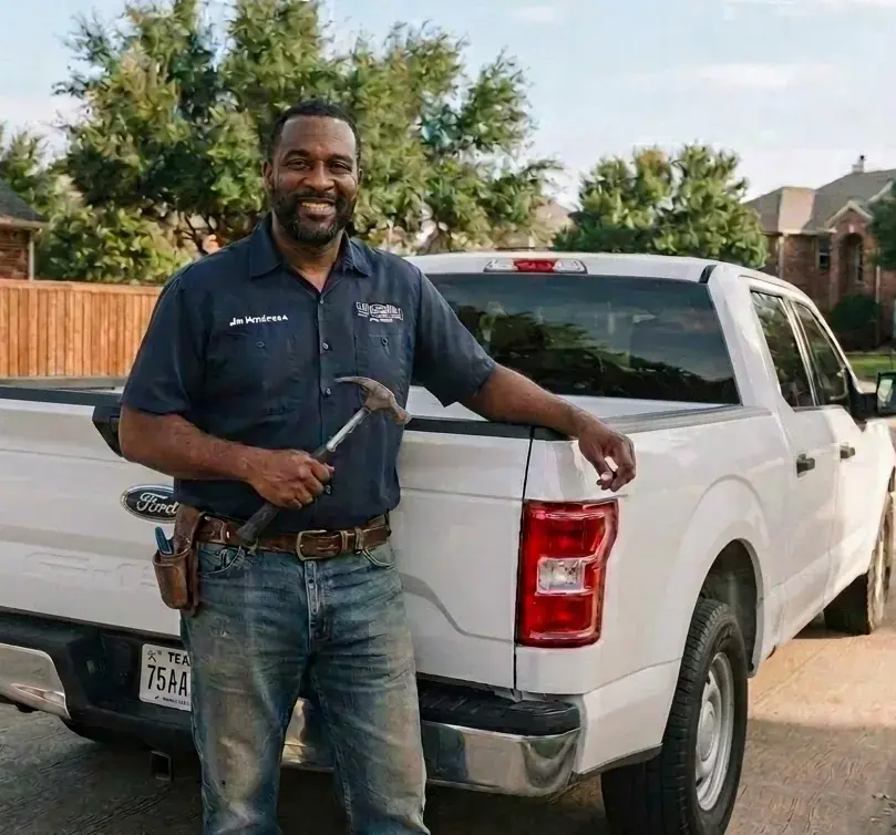 Jim Henderson leaning on his truck with a hammer, ready for work in McKinney