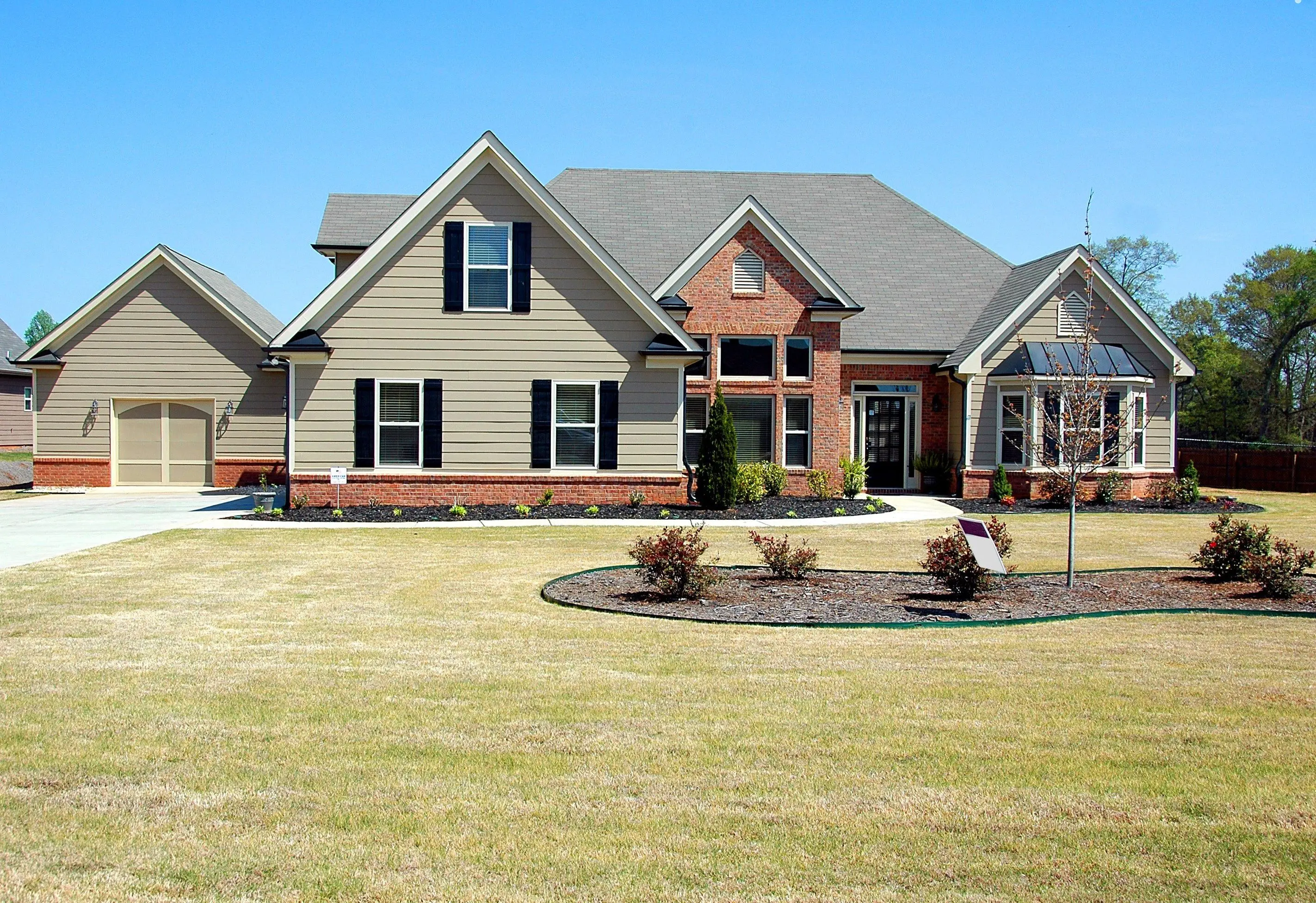 Landscaped front lawn and garden beds at a Fort Worth home